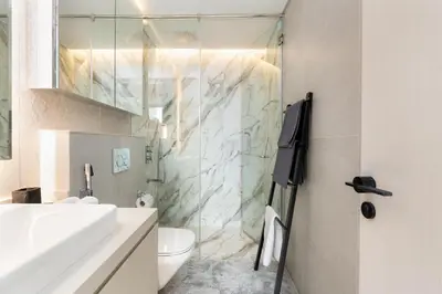 a bathroom with a glass shower and a toilet at BLVD - Direct Marina Walk - Eye of Dubai Fireworks - Iconic Marina Views with Rooftop Pool in Dubai