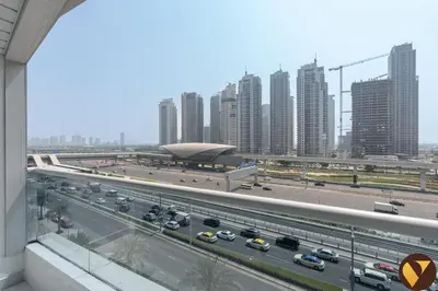 a view of a highway in a city with tall buildings at Vogue Marina Diamond Near JBR Beach and Marina Mall, One Bedroom Apartment with Balcony and City View, Access to all Amenities, Walkable to Sobha Realty Metro Station and Bus Stop in Dubai