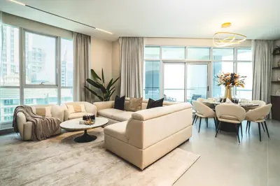 a living room with a couch and a table at Penthouse on 74th Floor 3 Bedrooms Palm Views in Dubai
