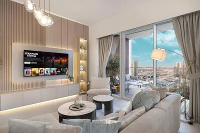 a living room with a couch and a tv at Luxury 4BR Burj View Steps from Dubai Mall in Dubai