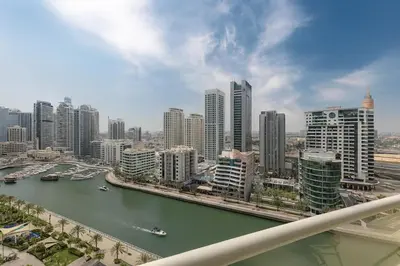 a view of a city with a river and buildings at Luxury 1BR with Marina Views Swimming Pool Gym in Dubai