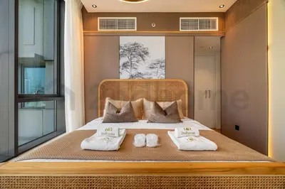 a bedroom with a bed with two towels on it at Burj Khalifa View - New Furnished Unit in Downtown in Dubai