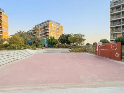 an empty basketball court with buildings in the background at FIRST CLASS Studio Cozy Comfort in Dubai