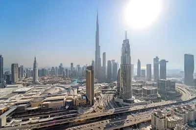 an aerial view of a large city with traffic at Luxury 4BR with full Burj Khalifa and Fountain View - 5Min to Dubai Mall in Dubai