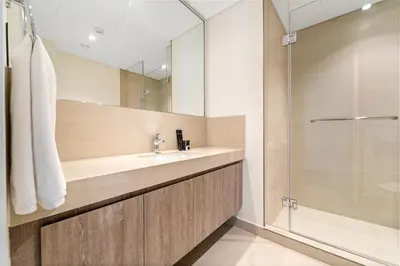 a bathroom with a sink and a shower at Luxury 4BR with full Burj Khalifa and Fountain View - 5Min to Dubai Mall in Dubai