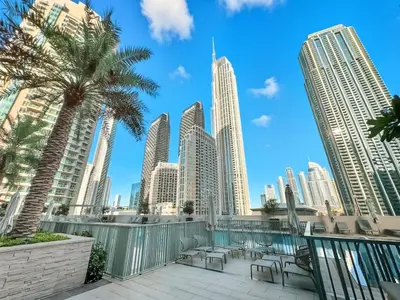a view of a city skyline from a balcony at Burj Khalifa View Next to Dubai Mall Sleeps 12 in Dubai