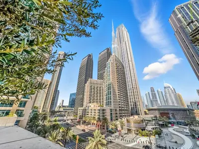 a view of a city skyline with tall buildings at Burj Khalifa View Next to Dubai Mall Sleeps 12 in Dubai