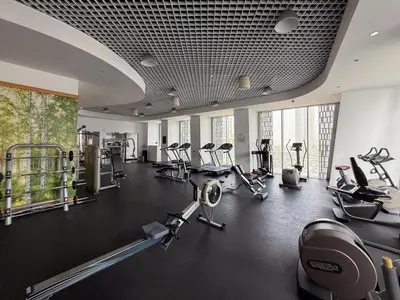 a gym with several treadmills and cardio machines at GuestReady - Spectacular Marina Views | High Floor in Dubai
