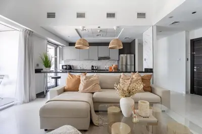 a living room with a couch and a table at GuestReady - Spectacular Marina Views | High Floor in Dubai