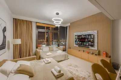 a bedroom with two beds and a window at Walk to Dubai Mall and Burj Khalifa Luxury 2 Bed - sleep up to 10 in Dubai