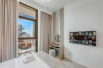 a hotel room with a bed and a window at Walk to Dubai Mall and Burj Khalifa Luxury 2 Bed - sleep up to 10 in Dubai