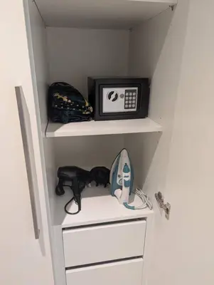 a closet with a shelf with a microwave on it at Walk to Dubai Mall and Burj Khalifa Luxury 2 Bed - sleep up to 10 in Dubai