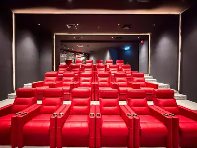 a theater with red seats in a room at GuestReady - Dubai Skyline & Canal View | 1 BHK in Dubai