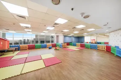 a large room with colorful mats on the floor at Cozy Studio at walking distance from Burj Khalifa and Downtown Dubai in Dubai
