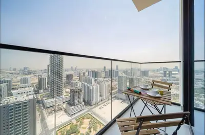 a balcony with a view of a city at High Floor apartment in Jumeirah Village Circle in Dubai