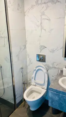 a bathroom with a toilet and a sink at Studio in May 5 Boulevard in Dubai