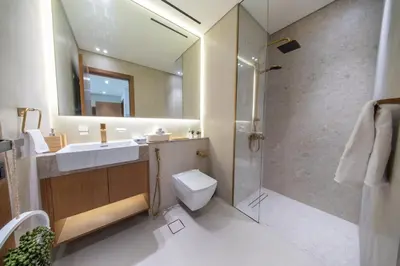 a bathroom with a sink toilet and a shower at Sleeps 4 I Pool I Circle Mall I Epic Pool in Dubai