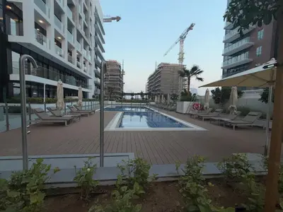 a swimming pool in the middle of a building at Azizi 205 Fully Furnished Apartment in Dubai