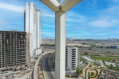 a view of a city with tall buildings at EasyGo - Elegant 2 Bedroom near Miracle Garden in Dubai