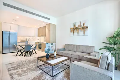 a living room with a couch and a table at Beach Vista - Stunning Sea View in Dubai