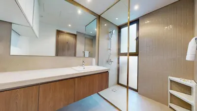 a bathroom with a sink and a mirror at Vacationer l Luxury Comfort 2 Bed Villa with Garden & Garage I Motor City in Dubai