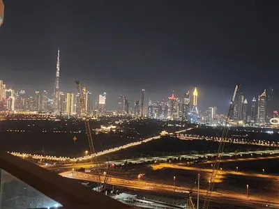 a view of a city at night with at City View Apartment 5 min to Downtown and 5 min to World Trade Center DIFC in Dubai