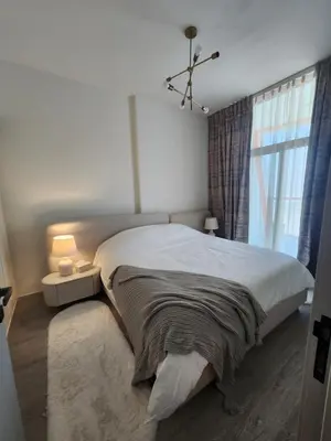 a bedroom with a large bed and a window at City View Apartment 5 min to Downtown and 5 min to World Trade Center DIFC in Dubai