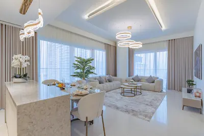 a living room with a table and a couch at Elegant 2BR with Sea View & Direct Beach Access in Dubai