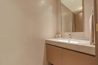 a bathroom with a sink and a mirror at Elegant 2BR with Sea View & Direct Beach Access in Dubai