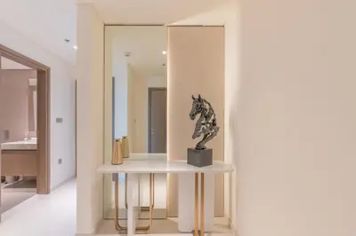 a statue of a horse on a table in a room at Elegant 2BR with Sea View & Direct Beach Access in Dubai