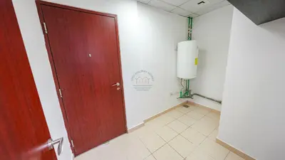 a red door in a room with a tile floor at Premium 1BR With Stunning Marina & Sea Views in Dubai