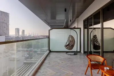 a room with a view of a city at Brand New Grand 2BR Duplex apartment in Jumeirah Village Circle with Pool, Gym and kids playground in Dubai