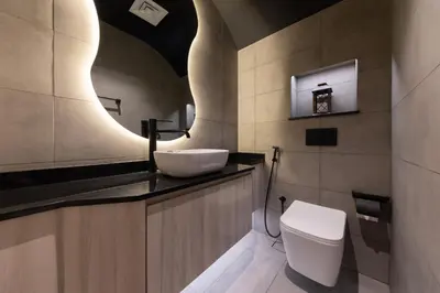 a bathroom with a sink and a toilet at Brand New Grand 2BR Duplex apartment in Jumeirah Village Circle with Pool, Gym and kids playground in Dubai