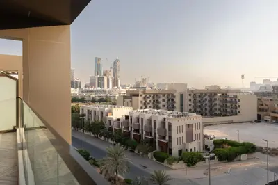 a view of a city from a building at Brand New Grand 2BR Duplex apartment in Jumeirah Village Circle with Pool, Gym and kids playground in Dubai