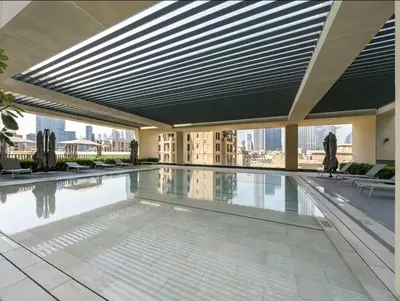 a swimming pool on the roof of a building at 1BR in Emaar Burj Royale - 1min walk to Fountain&Dubai Mall, Burj view Pool & gym in Dubai