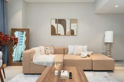 a living room with a couch and a table at 1BR w Marina Views & Balcony in Dubai