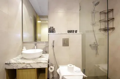 a bathroom with a sink and a shower at Luxury Studio in Aykon Tower - Pool & Gym Access in Dubai