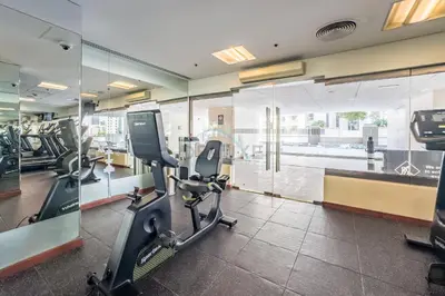 a gym with treadmills and ellipticals in a building at 1BR Near Burj Khalifa and Dubai Mall, Easy Access to Dubai Marina and Palm Jumeirah by Road or Metro, BLVD Walk, Downtown Dubai by Deluxe Holiday Homes in Dubai
