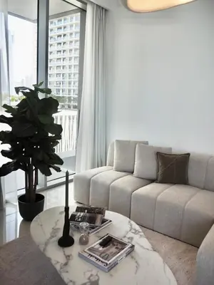a living room with a couch and a table at OceanView 1bed apartment with Private Beach in Dubai