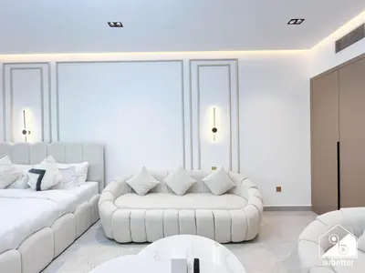 a white living room with two white couches at Relaxing ST Getaway l Balcony, Pool & Gym Access in Dubai