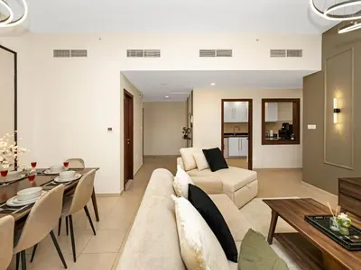a living room with a couch and a table at Jumeirah Beachfront with Ain View and Sea View 2BR in Dubai