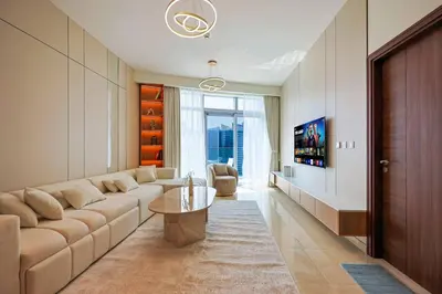 a living room with a couch and a table at Modern Sophistication with Stunning City Views in Dubai