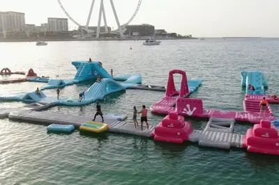 a group of people playing in the water at a water park at JBR Dubai VIP Lux Penthouse priv Pool cinema Limo tranfer-housekeeper in Dubai