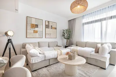 a living room with a couch and a table at Mahogany 18 - 2BR 10 Guests - Walk to Dubai Mall in Dubai