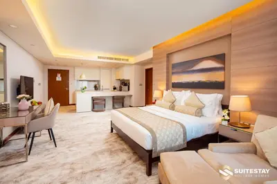 a large bedroom with a bed and a kitchen at Suitestay-Fahion Avenue Dubai mall in Dubai