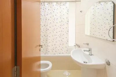 a bathroom with a sink and a toilet and a window at Limelight Partiton Room In Tecom Barsha Heights Near ICM Metro in Dubai