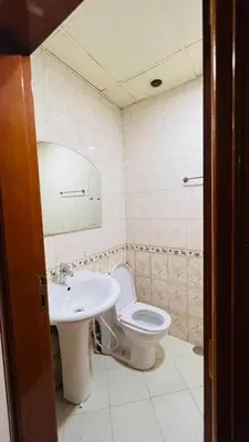 a bathroom with a toilet and a sink at Private Double Room In Barsha Heights Near Metro in Dubai