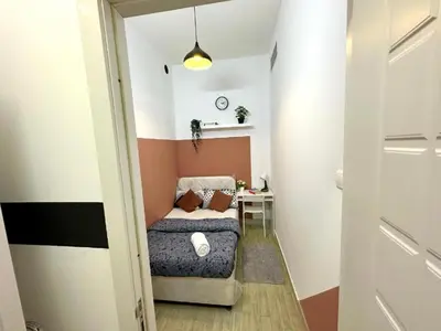 a small room with a bed and a table at Furnished Partiton Room in Tecom Barsha Heights Near ICM Metro in Dubai