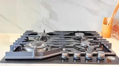 a stove top with pots and pans on it at Premium Studio In Jvc Bazr in Dubai