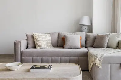 a living room with a couch and a coffee table at 1BR with Direct Burj Khalifa View in Dubai